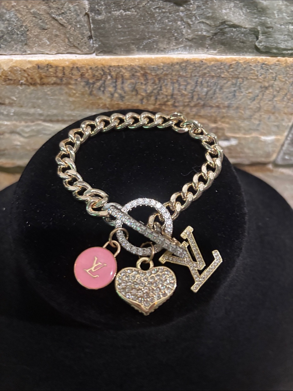 Gold Toned Charm Bracelet with LV logo charm & Pave Crystal Charms